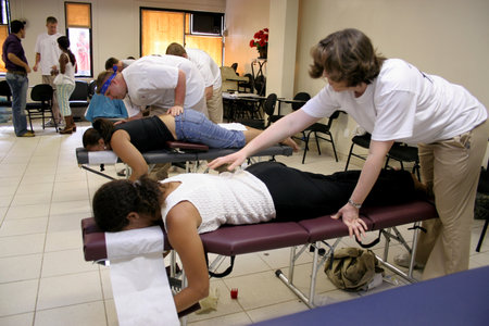salvador, bahia / brazil - march 1, 2007: person is seen doing chiropractic activities on a patient in the city of Salvador.のeditorial素材