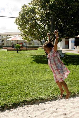 salvador, bahia / brazil - june 27, 2009: child is seen playing on zip lines in a condominium boat in the city of Salvador.のeditorial素材