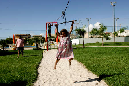 salvador, bahia / brazil - june 27, 2009: child is seen playing on zip lines in a condominium boat in the city of Salvador.のeditorial素材