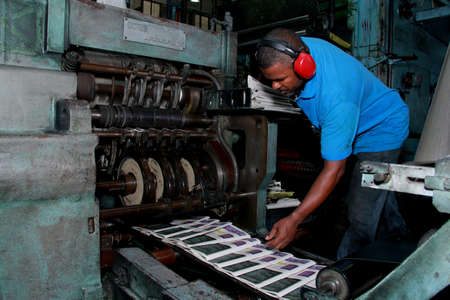 salvador, bahia / brazil - october 11, 2012: workers are seen in a printed newspaper graphic park in the city of Salvador.のeditorial素材