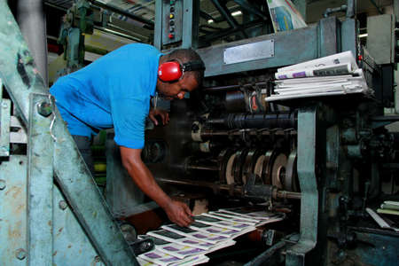 salvador, bahia / brazil - october 11, 2012: workers are seen in a printed newspaper graphic park in the city of Salvador.のeditorial素材