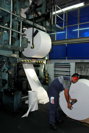 salvador, bahia / brazil - october 11, 2012: workers are seen in a printed newspaper graphic park in the city of Salvador.のeditorial素材