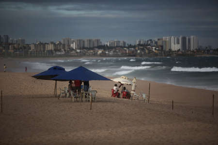 salvador, bahia / brazil - july 10, 2017: Man is seen at the Itapua Mermaid Beach in the city of Salvador.のeditorial素材