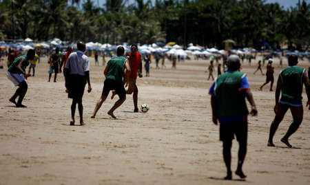 salvador, bahia / brazil - october 26, 2014: People are seen practicing soccer match at Piata Beach...