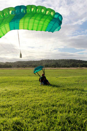 itaparica, bahia / brazil - august 18, 2012: person is seen during a parachute jump on the island of Itaparica.のeditorial素材