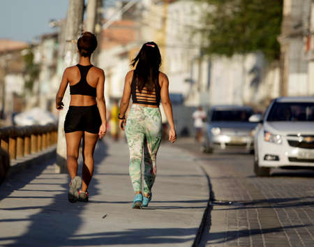 salvador, bahia / brazil - december 2, 2015: people are seen walking on Avenida Beira Mar in the Ribeira neighborhood in the city of Salvador.のeditorial素材