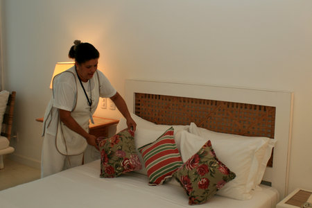 porto Seguro, bahia / brazil - august 30, 2008: woman is seen working as a chambermaid in a hotel room in the city of Porto Seguro, in the south of Bahia.のeditorial素材
