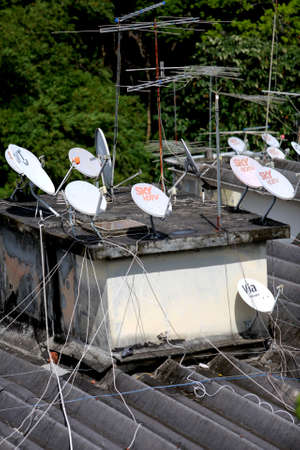 salvador, bahia / brazil - june 8, 2015: Subscription TV antennas are seen on a rooftop of residential building in the Paralela neighborhood of Salvador.のeditorial素材