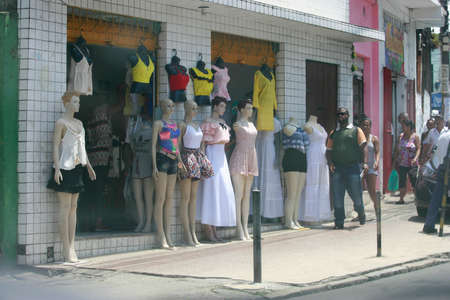 salvador, bahia / brazil - december 30, 2016: People pass close to store mannequins in the neighborhood of Liberdade in the city of Salvador.のeditorial素材