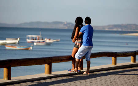salvador, bahia / brazil - december 2, 2015: couple is seen on Avenida Beira Mar in the Ribeira neighborhood in the city of Salvador.のeditorial素材