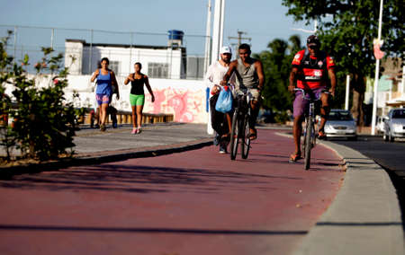 salvador, bahia / brazil - december 2, 2015: cyclist on a bike path on Avenida Beira Mar in the Ribeira neighborhood in the city of Salvador.のeditorial素材