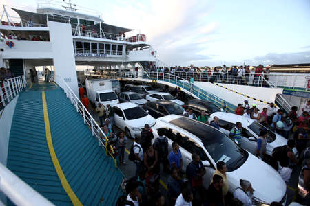 salvador, bahia, brazil - september 5, 2017: passengers and vehicles disembarking from the Dorival...