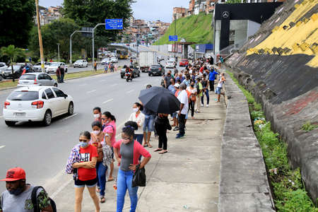 salvador, bahia, brazil - july 6, 2021: people queuing to receive Jansen coronavirus vaccine at a...