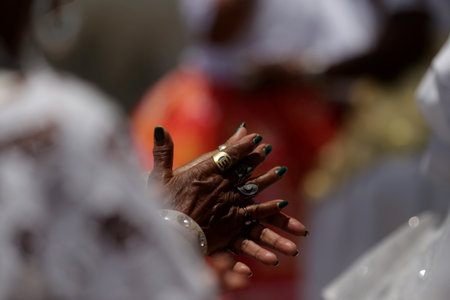 salvador, bahia, brazil - november 20, 2018: Members of the Candombles religion are seen during a religious procession in the city of Salvador.のeditorial素材