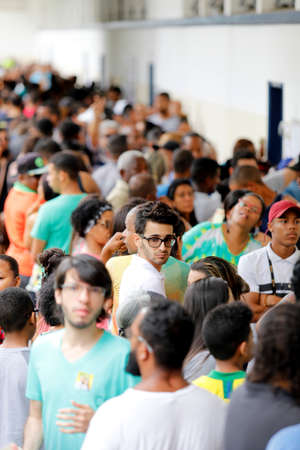salvador, bahia, brazil - october 7, 2018: People are seen queuing at a polling station during election in the city of Salvador.のeditorial素材