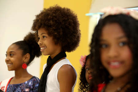 salvador, bahia, brazil - october 13, 2017: Children of black ethnicity are seen in a beauty salon in the city of Salvador.のeditorial素材