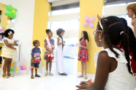 salvador, bahia, brazil - october 13, 2017: Children of black ethnicity are seen in a beauty salon in the city of Salvador.のeditorial素材