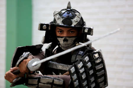 salvador, bahia, brazil - april 24, 2017: Young man wears armor made of imitation paper warrior with armor in Salvador city.のeditorial素材