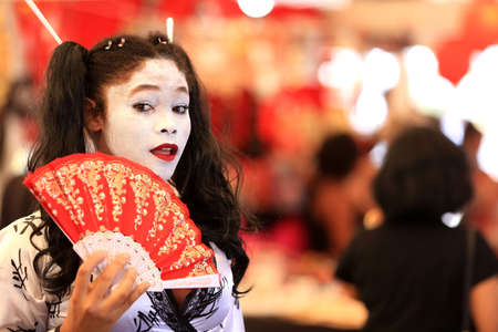 salvador, bahia, brazil - august 27, 2016: Young girl celebrates geisha costume during Japanese culture festival in Salvador city.のeditorial素材