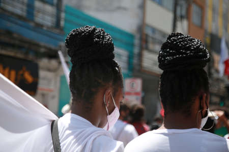 salvador, bahia, brazil - september 7, 2021: young people of black ethnicity wearing hair braids are seen in the city of Salvador.のeditorial素材