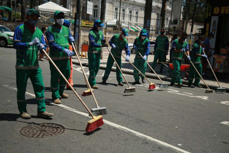 salvador, bahia, brazil - september 7, 2021: street sweeper is seen while cleaning a street in downtown Salvador.のeditorial素材