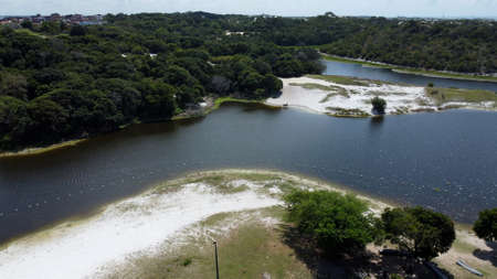 Salvador, Bahia, Brazil - September 16, 2021: aerial view of Lagoa do Abaete, in the neighborhood of Itapua in the city of Salvador. The lake is located in the Metropolitan Park of Abaete.のeditorial素材
