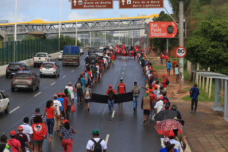 salvador, bahia, brazil - april 15, 2019: Members of the Sem Terra Movement - MST - are seen walking along Avenida Luiz Viana, in Salvador, during a demonstration in search of agrarian reform.のeditorial素材
