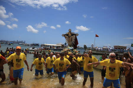 salvador, bahia, brazil - january 1, 2017: image of Bom Jesus dos Navegantes being carried by devotees on Boa Viagem beach after crossing the sea at Baia de Todos os Santos in Salvador.のeditorial素材