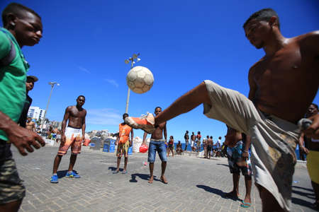 salvador, bahia, brazil - february 9, 2016: Carnival party workers are seen playing ball before work...