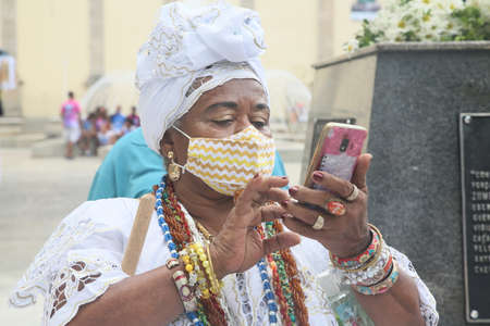 salvador, bahia, brazil - november 20, 2021: Candomble members and black entities participates in washing the statue of black leader Zumbi dos Palmares in the Historic Center of the City of Salvador.のeditorial素材