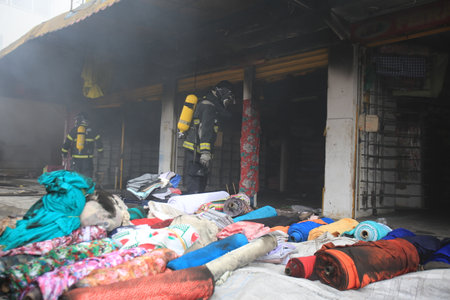 salvador, bahia, brazil - july 20, 2017: Members of the Fire Department firefighting the mattress factory in the city of Salvador.のeditorial素材
