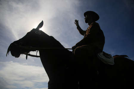 Conde, Bahia, Brazil - January 8, 2022: Cowboy wearing traditional leather clothes with his horse on...