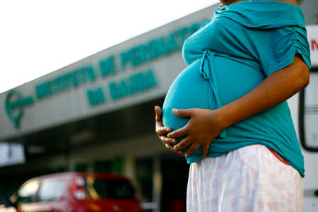 Salvador, Bahia, Brazil - August 8, 2014: A pregnant woman is seen in front of the Iperba maternity hospital in the city of Salvador.のeditorial素材