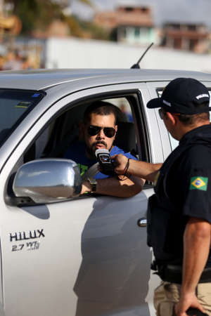 simoes Filho, Bahia, Brazil - October 11, 2018: Agent of the Federal Highway Police - PRF - inspects...