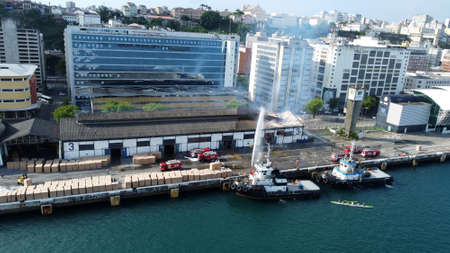 salvador, bahia, brazil - april 15, 2022: fire in a warehouse of Companhia das Docas do Estado da Bahia - Codeba - in the port of the city of Salvador.のeditorial素材