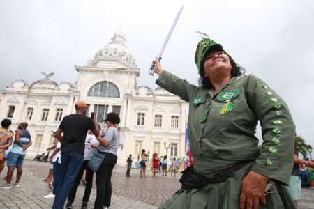salvador, bahia, brazil - july 2, 2022: A woman wears a costume of the heroine Maria Quiteria during the Dois de Julho festivities in the independence of Bahia in Salvador.のeditorial素材