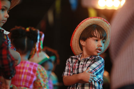 Salvador, Bahia, Brazil - June 11, 2022: children dancing square dance during a party in honor of sao joao in the city of salvador.のeditorial素材