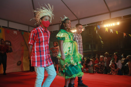 Salvador, Bahia, Brazil - June 11, 2022: children dancing square dance during a party in honor of...