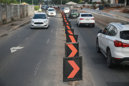 Salvador, Bahia, Brazil - July 19, 2022: lane reduction signage at street construction site in Salvador city.のeditorial素材