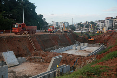 Salvador, Bahia, Brazil - July 29, 2022: construction of sewage pipeline exclusive way for BRT transport system in the Lucaia canal region in the city of Salvador.のeditorial素材