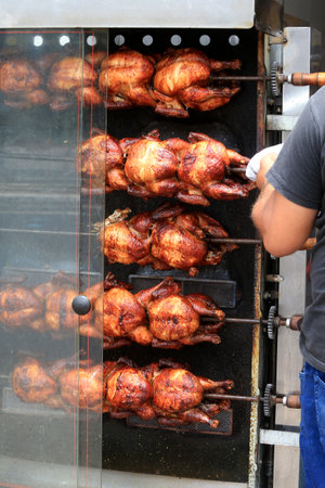 salvador, bahia, brazil - september 17, 2022: Roast chicken at a street restaurant in Salvador city.の写真素材