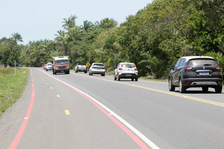 ilheus, bahia, brazil - october 7, 2022: view of vehicles traveling along the state highway BA 001 in the stretch between the city of Ilheus and Itacare in southern Bahia.のeditorial素材