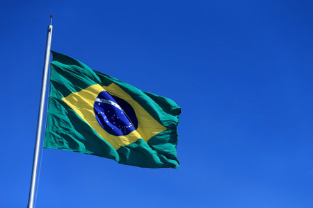 Salvador, Bahia, Brazil - October 30, 2022: Brazilian flag seen on a flagpole of a supermarket in the city of Salvador.のeditorial素材