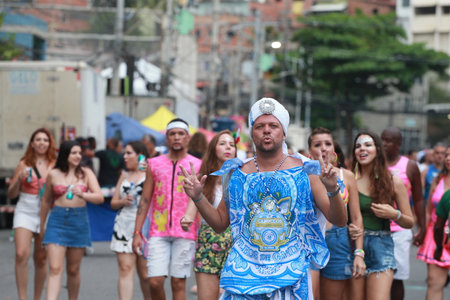 salvador, bahia, brazil - february 20, 2023: members of the Filhos de Gandy carnival block seen on...