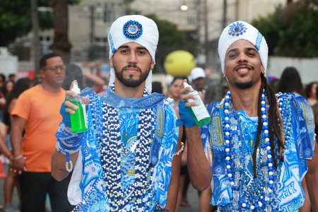 salvador, bahia, brazil - february 20, 2023: members of the Filhos de Gandy carnival block seen on the carnival circuit in the city of Salvador.のeditorial素材