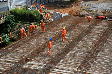 salvador, bahia, brazil - august 11, 2023: workers are seen at the construction of a bridge in the...