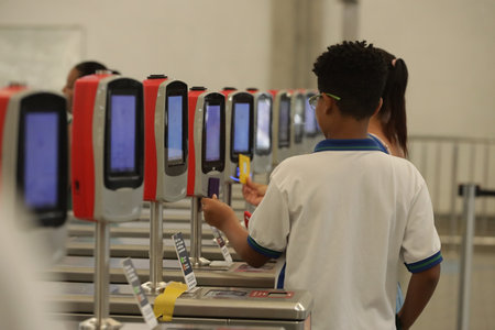 salvador, bahia, brazil may 10, 2024: passenger on the Salvador metro system uses a card to enter the station.のeditorial素材