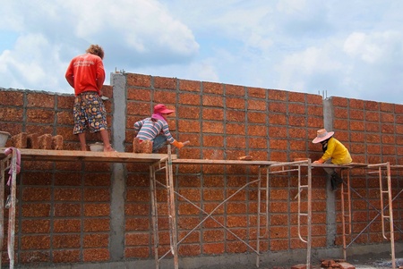 Bangkok  THAILAND - SEP 19   Unidentified Workers are Constructing large laterite brick wall on...