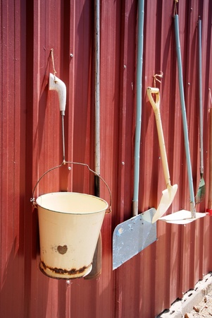 the hardware equipment for farm on the red wall の写真素材