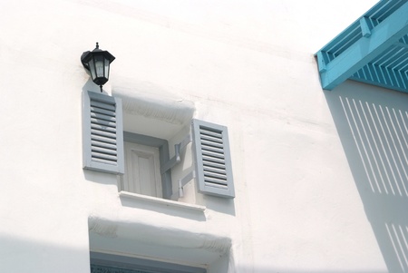 Vintage gray window on the white wall の写真素材